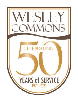 Wesley Commons retirement home logo.